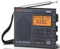 A black radio with a yellow display

Description automatically generated