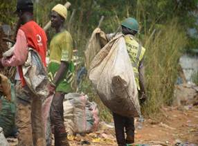 A group of men carrying bags

Description automatically generated